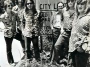 Members of the Atlanta Rhythm Section—(left to right) J.R. Cobb, Ronnie Hammond, Barry Bailey, Paul Goddard, Robert Nix, and Dean Daughtry—stand before a sign indicating the Doraville city limits.