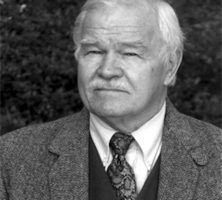 Author and academic Charles N. Hudson Jr. wearing a coat and tie.