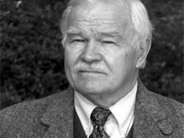 Author and academic Charles N. Hudson Jr. wearing a coat and tie.