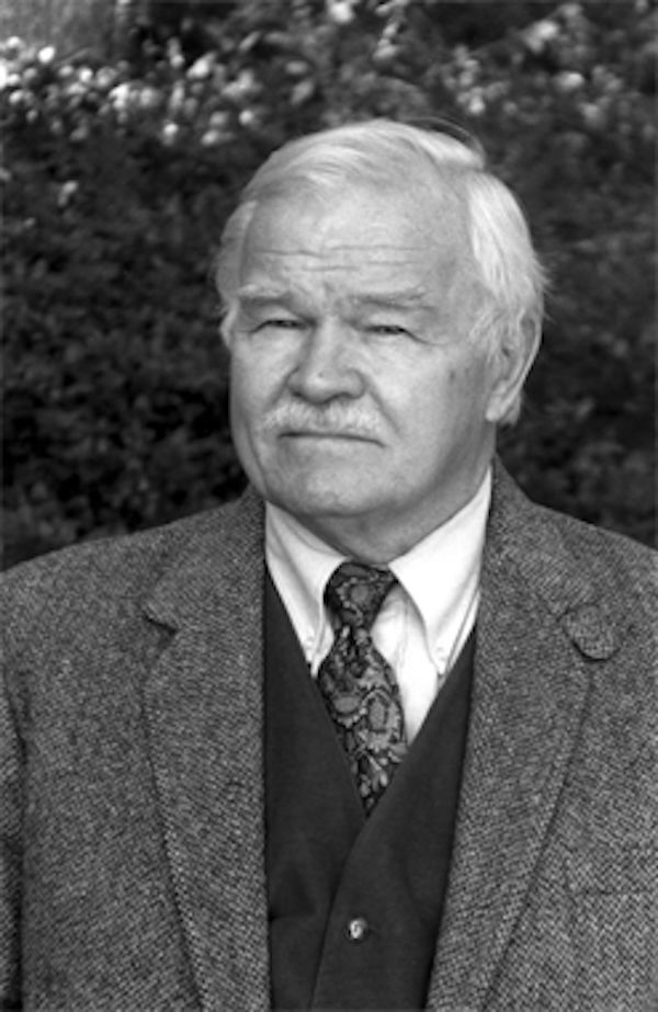 Author and academic Charles N. Hudson Jr. wearing a coat and tie.